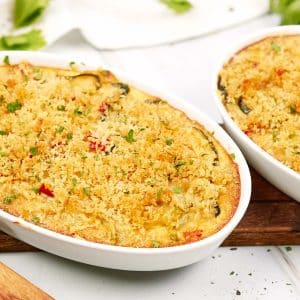 baking dish of mini squash casserole on a table ready to serve