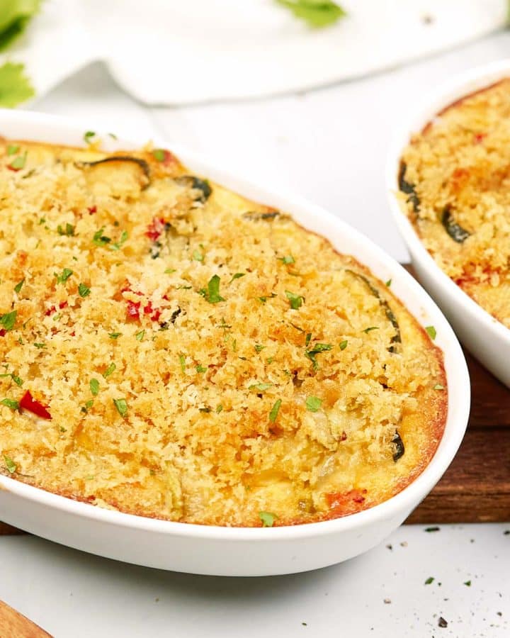baking dish of mini squash casserole on a table ready to serve