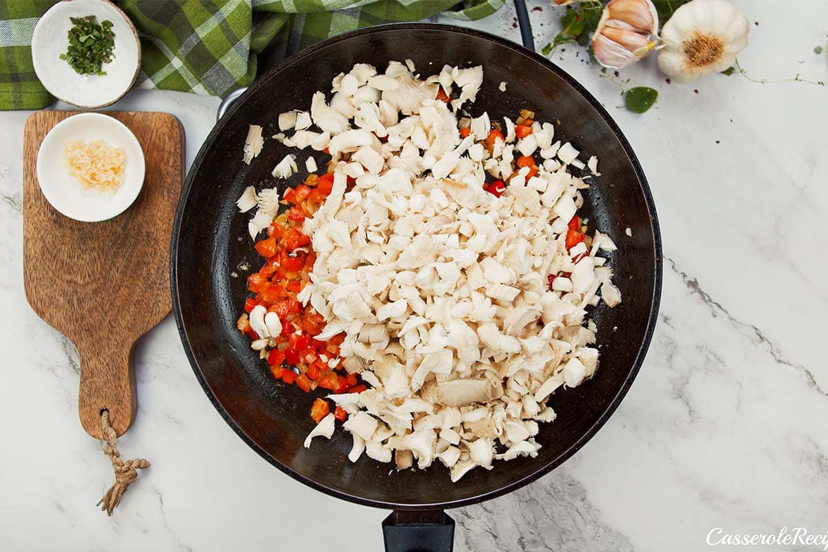 ingredients being combined to make noodle pizza casserole