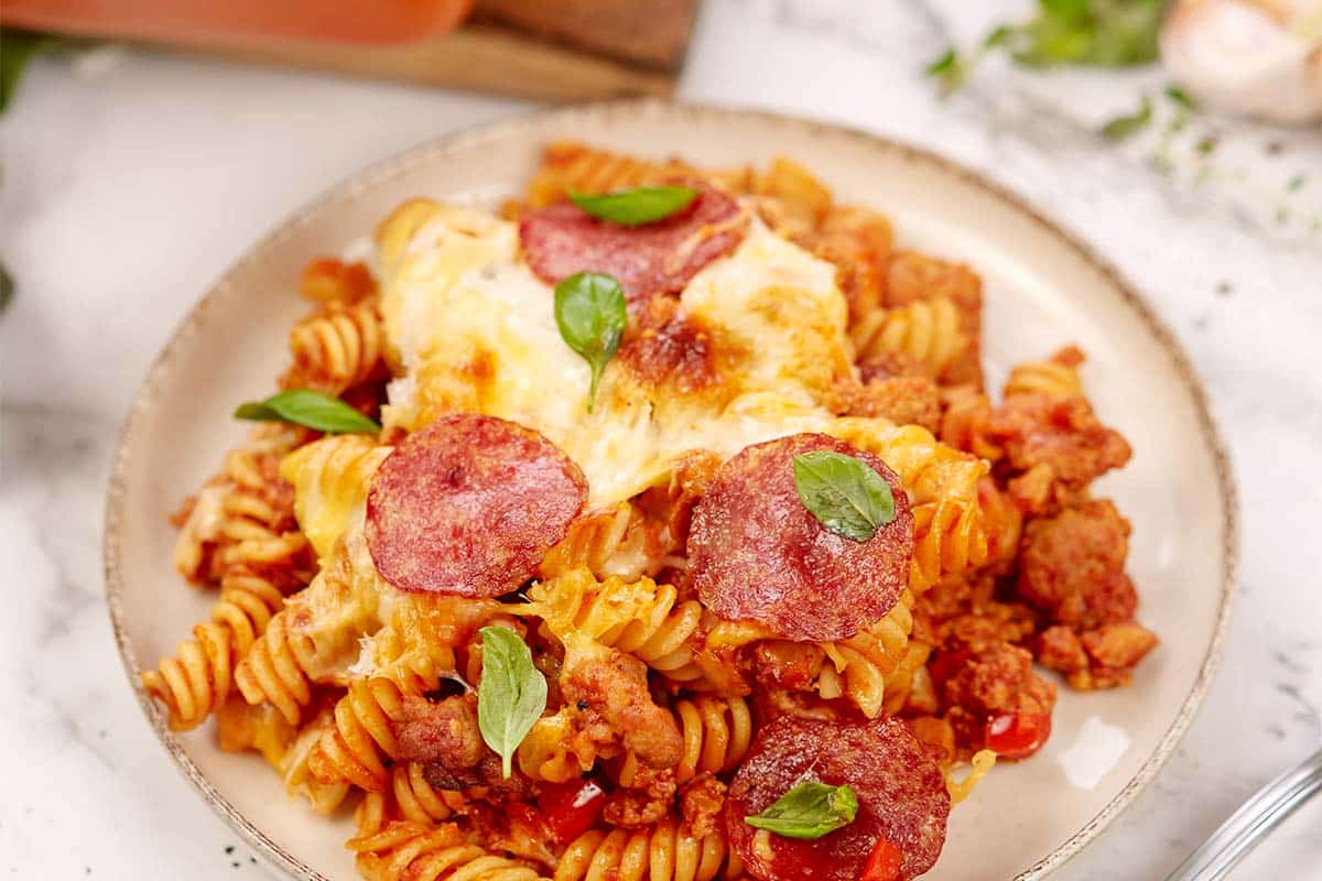 single serving of noodle pizza casserole on a plate ready to enjoy