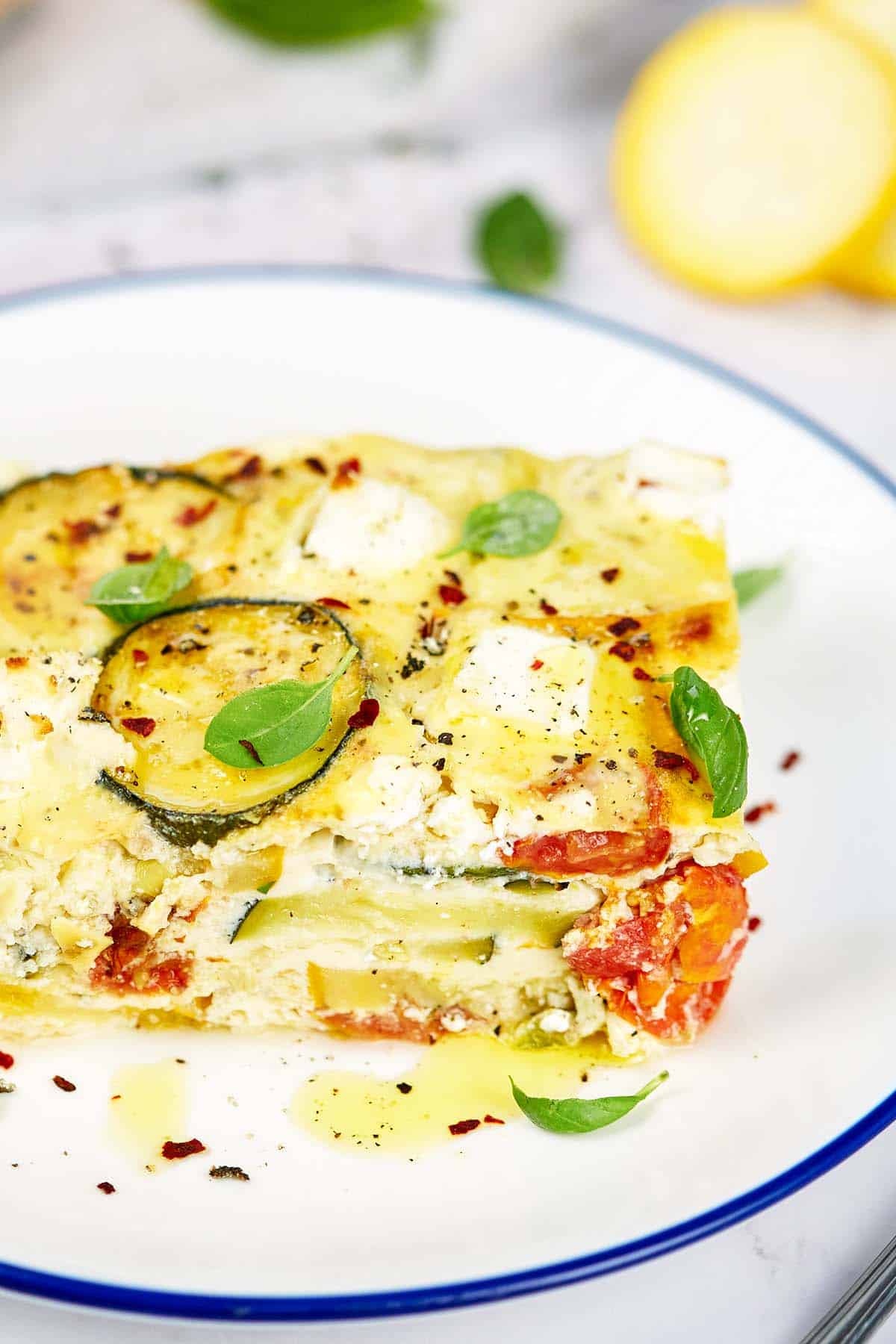 closeup of a plate containing a serving of oven-baked zucchini fritatta ready to enjoy