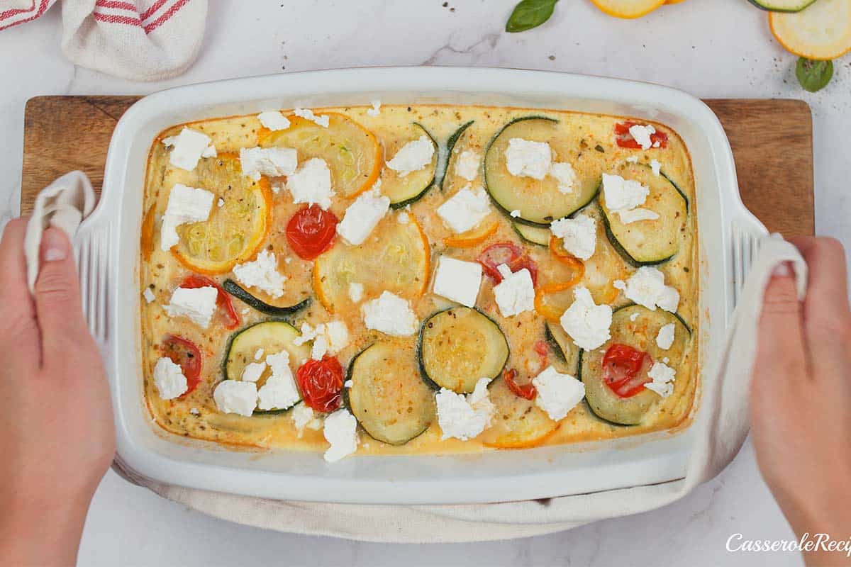layering ingredients in a baking dish to make oven-baked zucchini fritatta