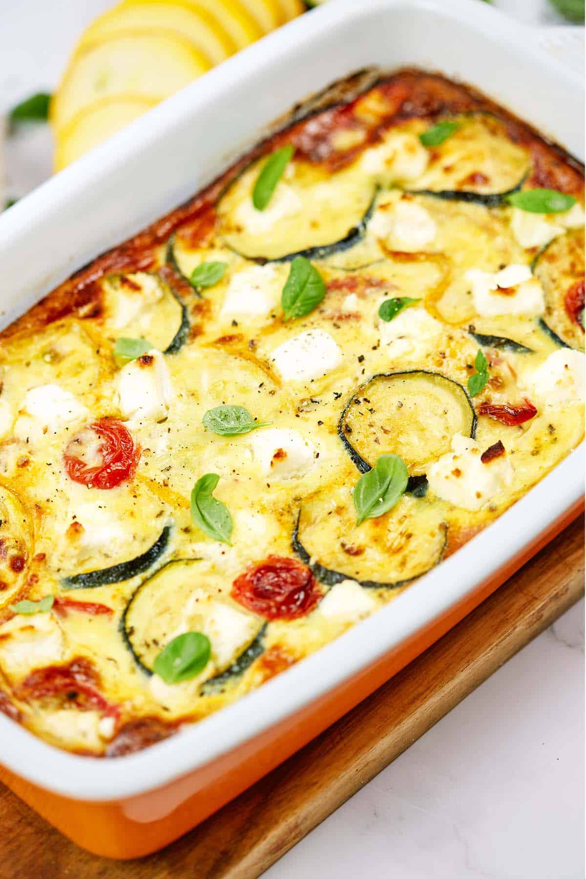 fresh from the oven oven-baked zucchini fritatta in a baking dish