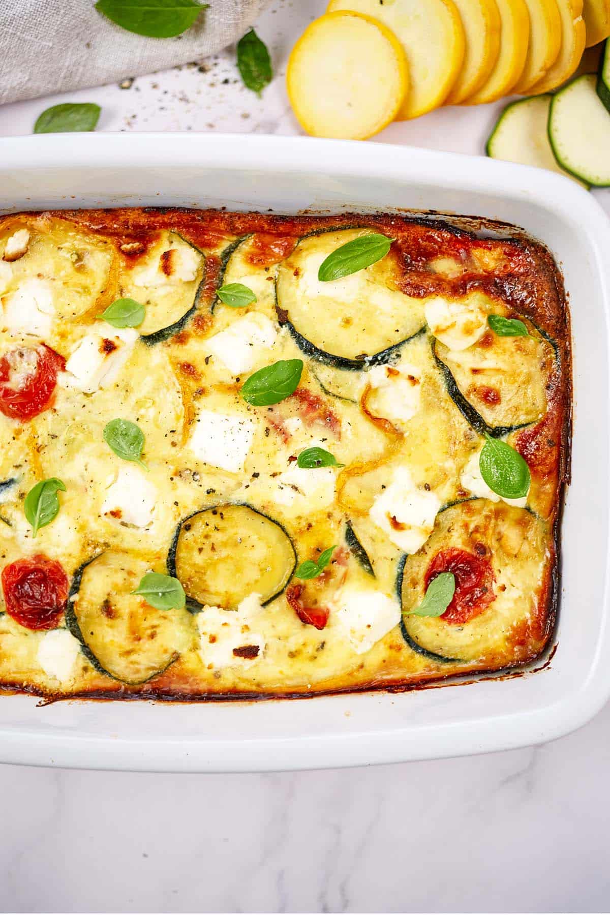 baking dish of oven-baked zucchini fritatta fresh from the oven ready to serve