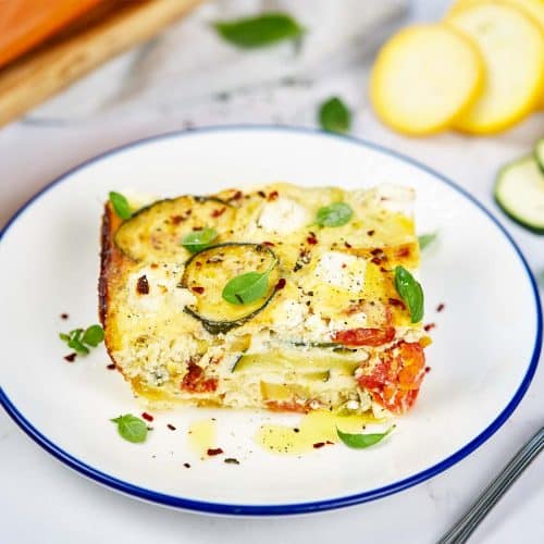 serving of oven-baked zucchini fritatta on a plate ready to enjoy