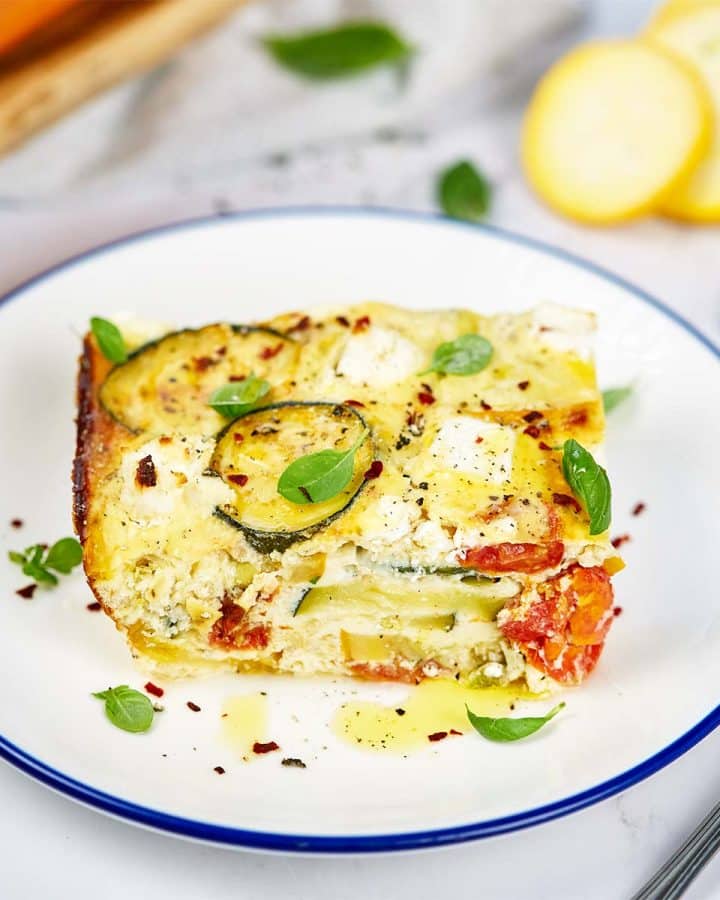 serving of oven-baked zucchini fritatta on a plate ready to enjoy