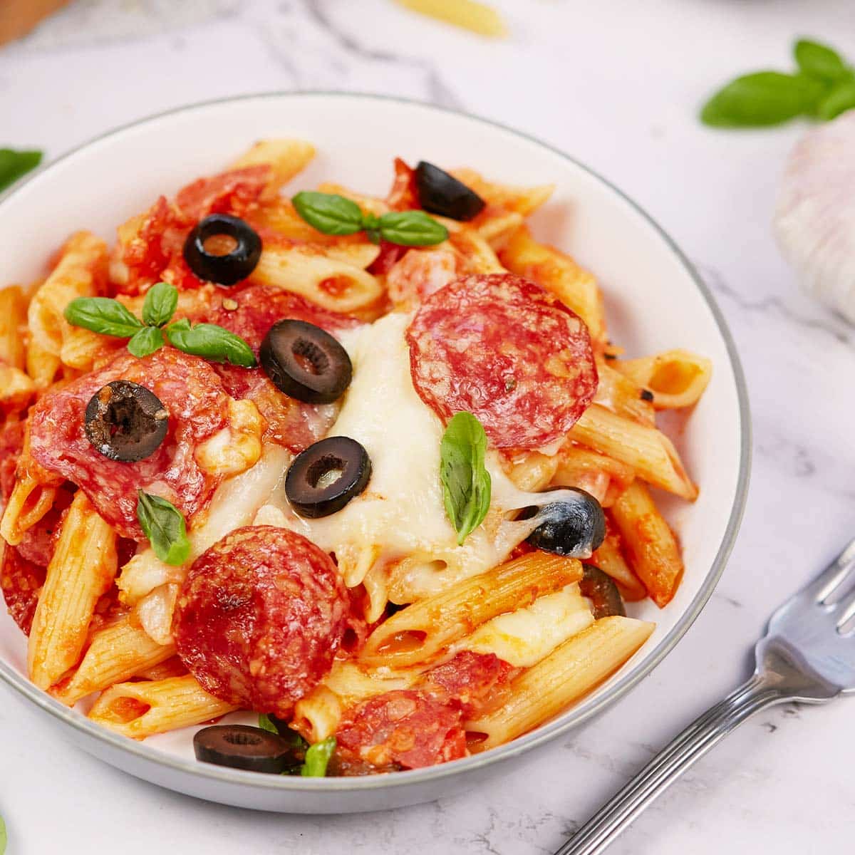 serving of pepperoni pasta bake in a bowl ready to enjoy