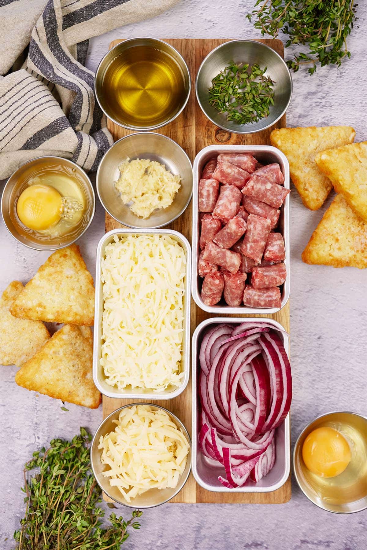 ingredients to make sausage hashbrown breakfast casserole laid out on a table