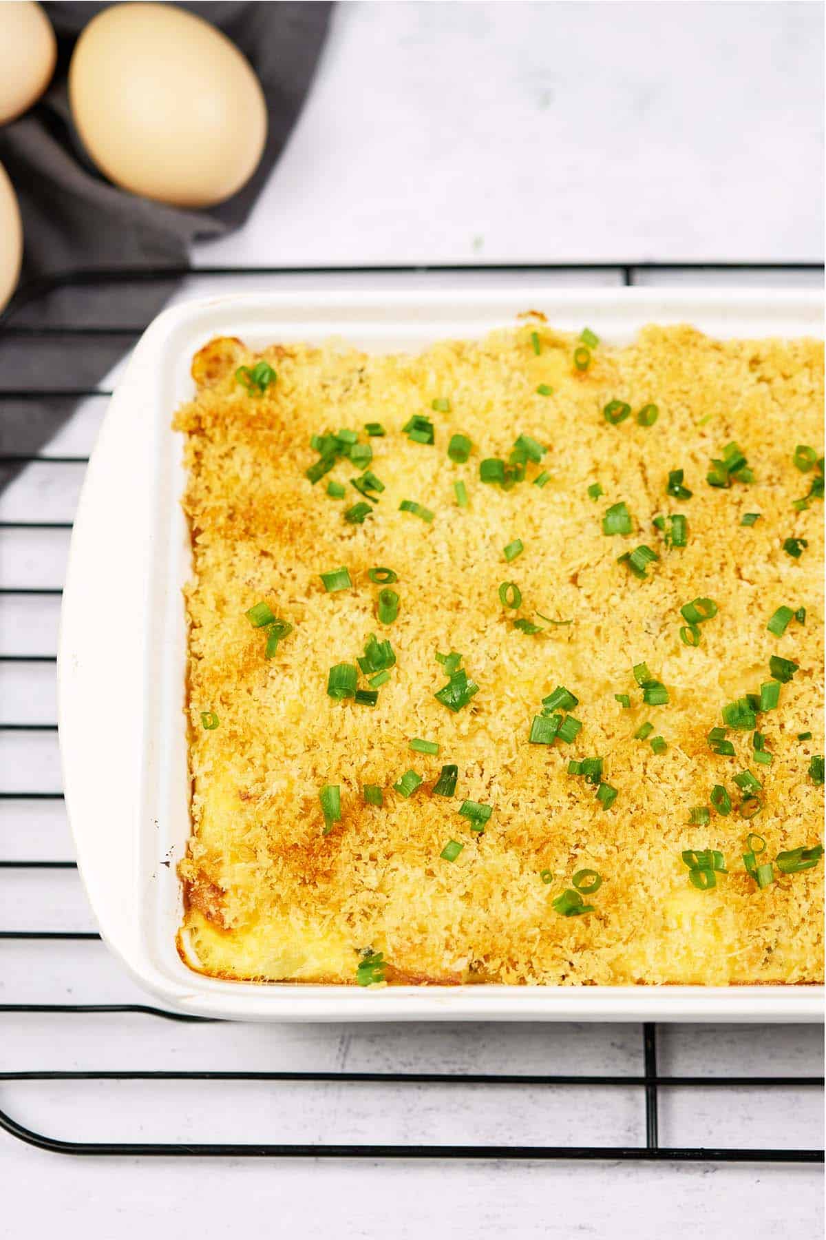 scrambled egg casserole in a baking pan on a table ready to serve