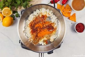 onions and other ingredients being sauteed to make shawarma casserole