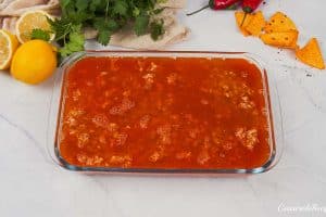final step of topping the filling to make shawarma casserole before baking