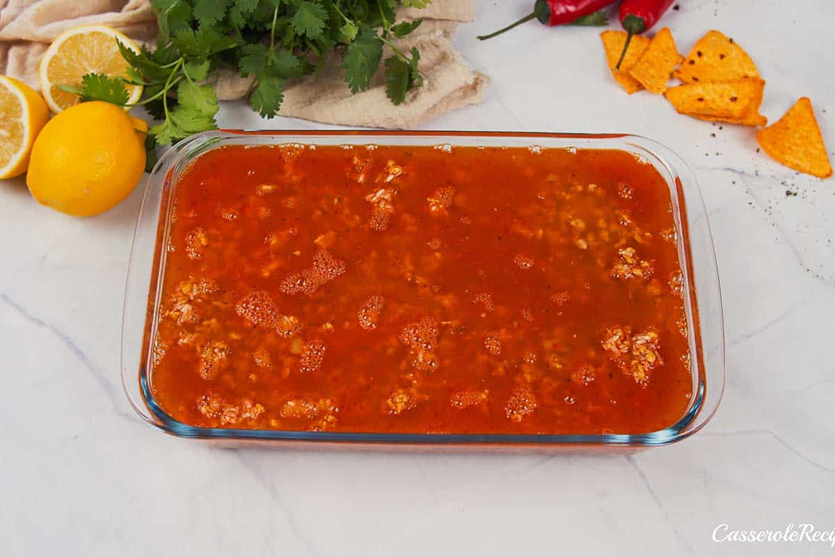 final step of topping the filling to make shawarma casserole before baking