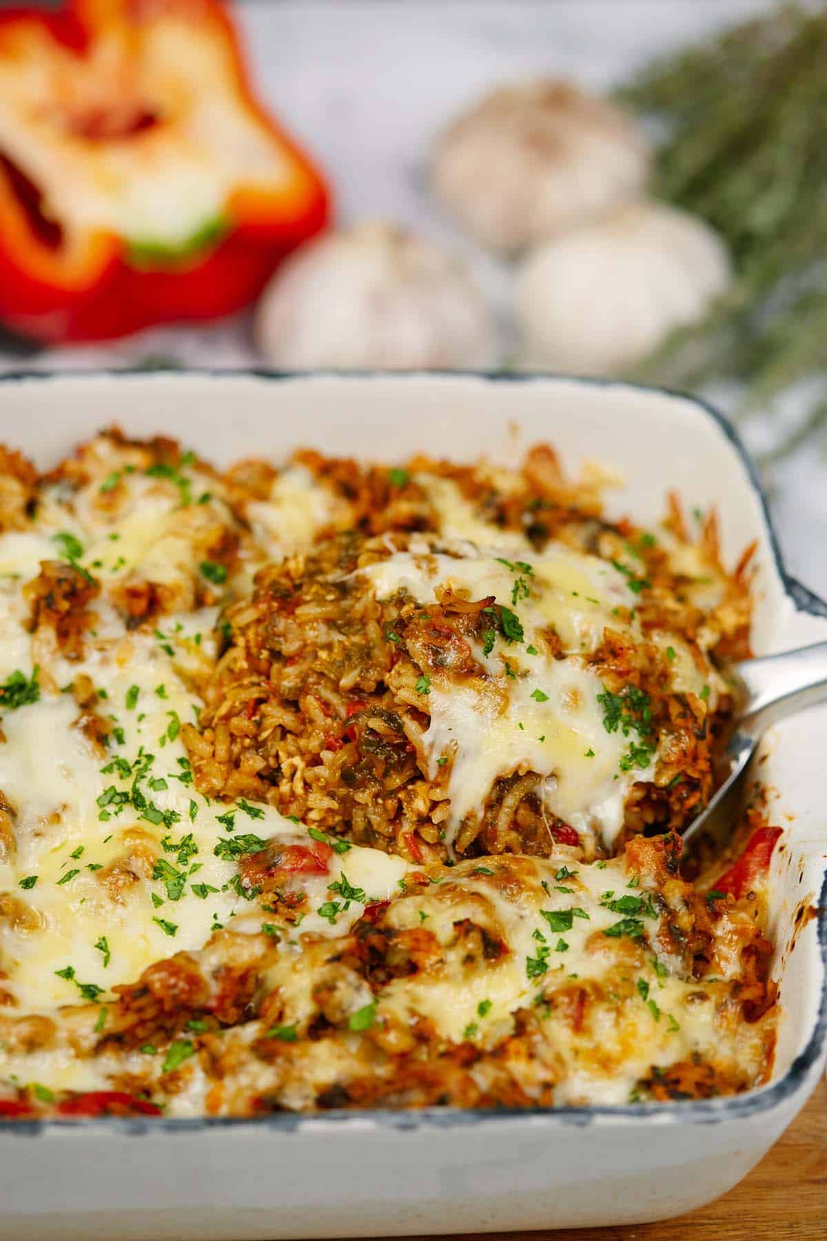 serving of stuffed pepper casserole being lifted out of a baking dish