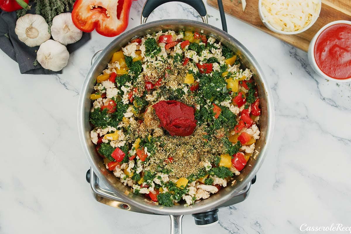 ingredients being added to a pot to make stuffed pepper casserole