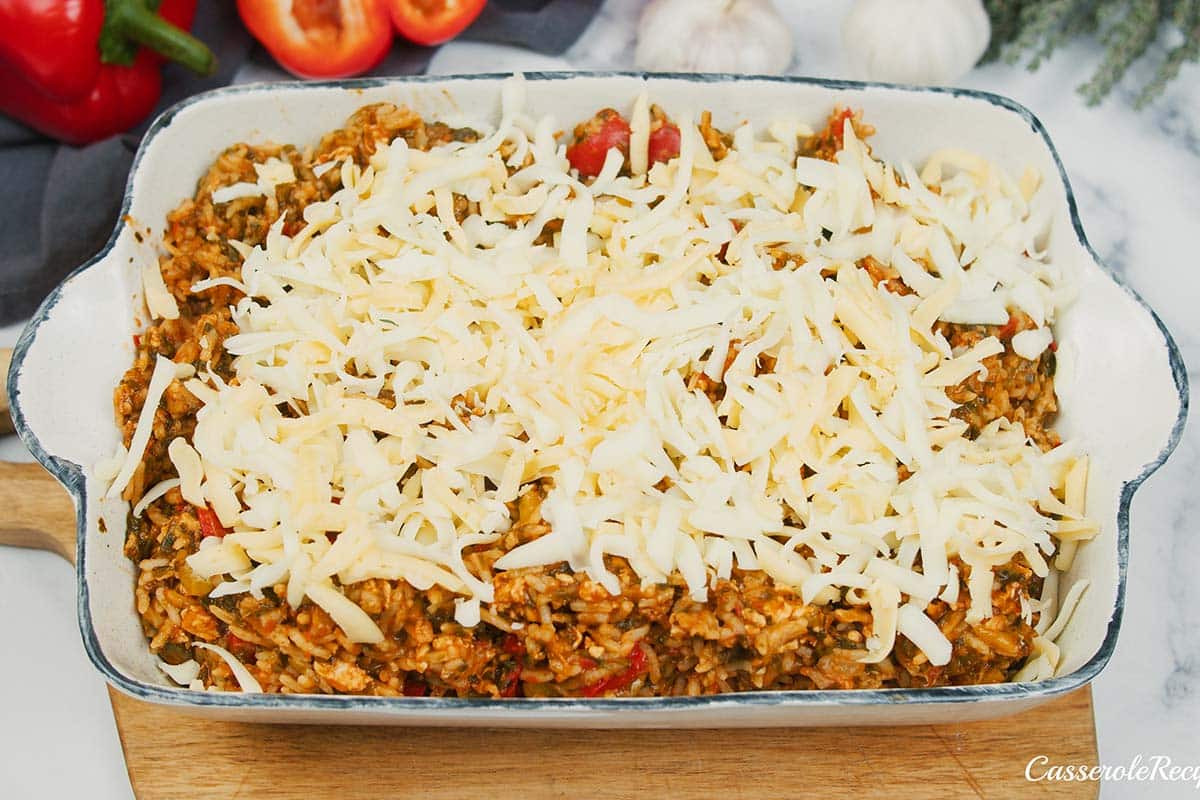 topping stuffed pepper casserole with cheese prior serving