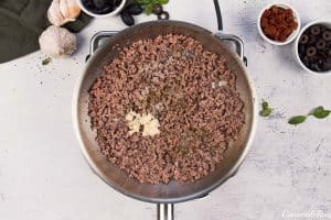 cooking ground beef to make upside down pizza casserole