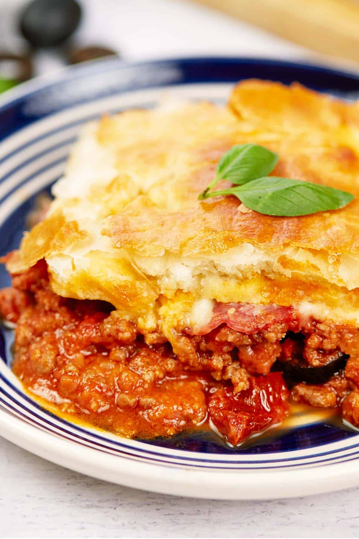 closeup of a serving of upside down pizza casserole on a plate