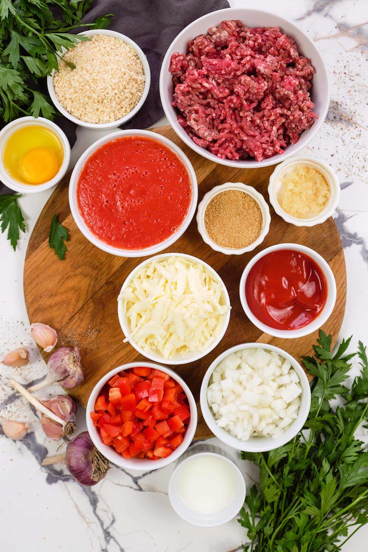 ingredients to make Sloppy Joe Meatball Bake laid out on a table