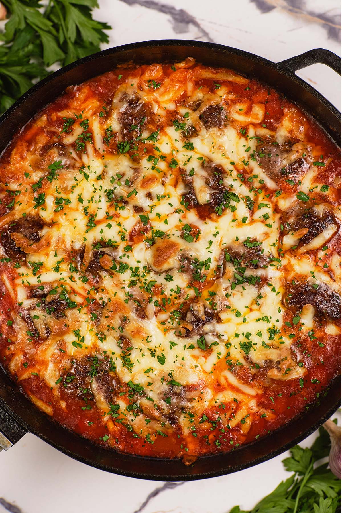 closeup of a skillet of Sloppy Joe Meatball Bake ready to serve