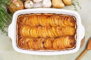 baking dish of beef hot pot casserole on a table ready to enjoy