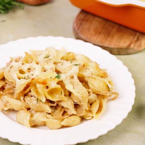 bowl with a serving of caramelized onion pasta bake ready to enjoy