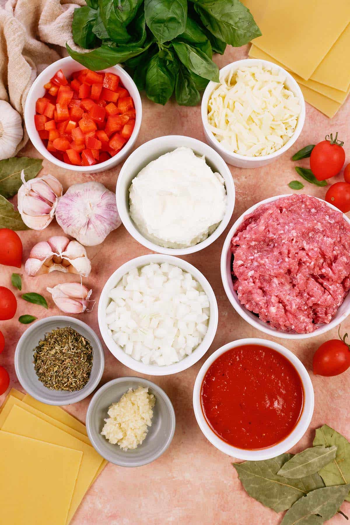 ingredients to make cheat lasagne bake laid out on a table