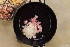 caramelizing onions to make chicken and tomato gnocchi bake