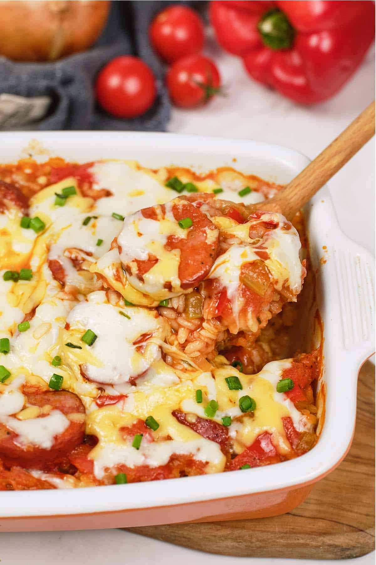 spoon scooping a serving of Louisiana Casserole from a casserole dish