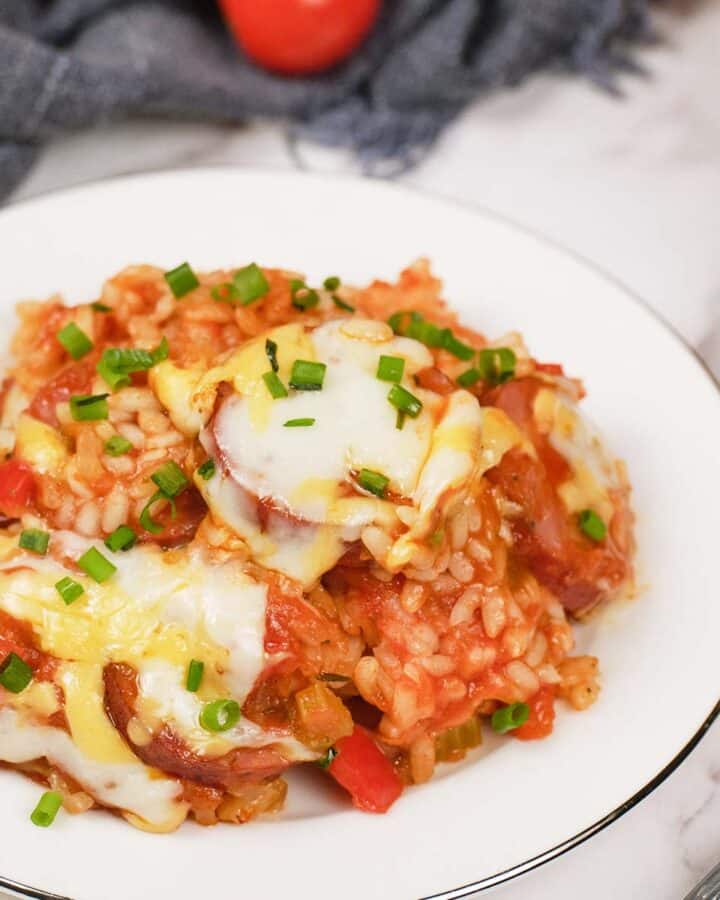 plate with a serving of Louisiana Casserole on a table ready to enjoy