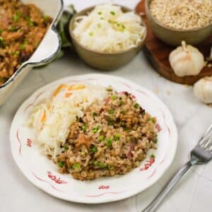 plate with a serving of mushroom barley casserole ready to enjoy