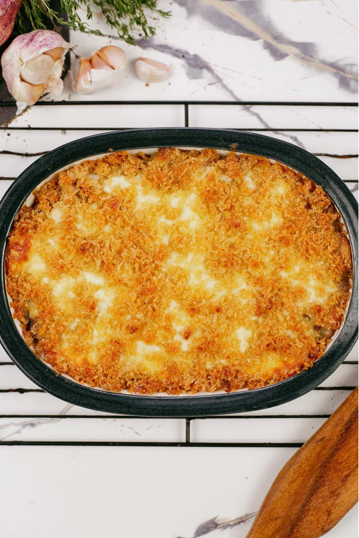 freshly made stuffed mushroom casserole on a cooling rack