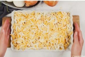 final step of how to make Tennessee Onions by topping with cheese prior to baking
