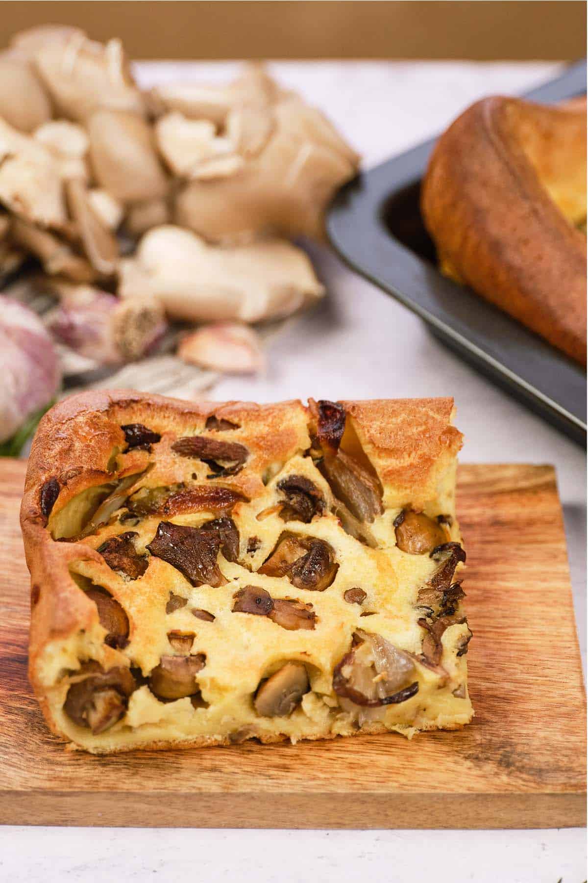 single serving of yorkshire pudding traybake served on a cutting board