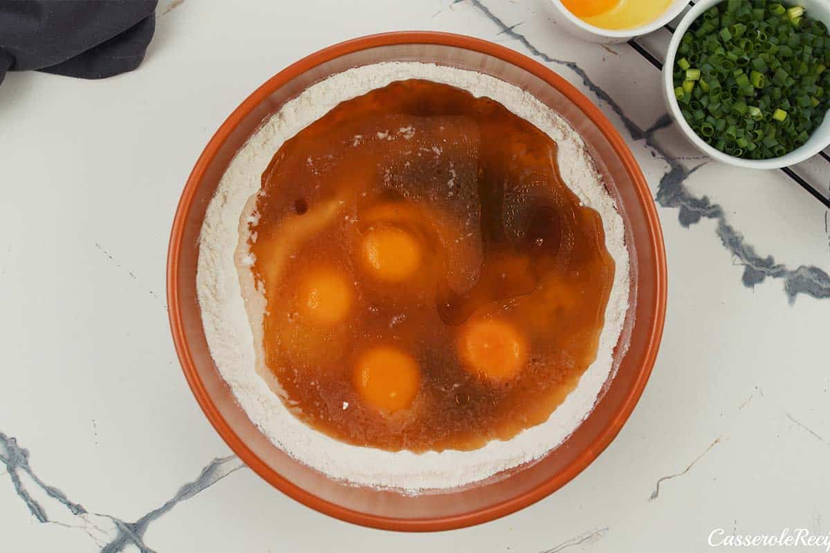 eggs and other ingredients being combined to make Okonomiyaki bake