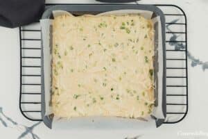 transferring filling for Okonomiyaki bake into a casserole dish to cook