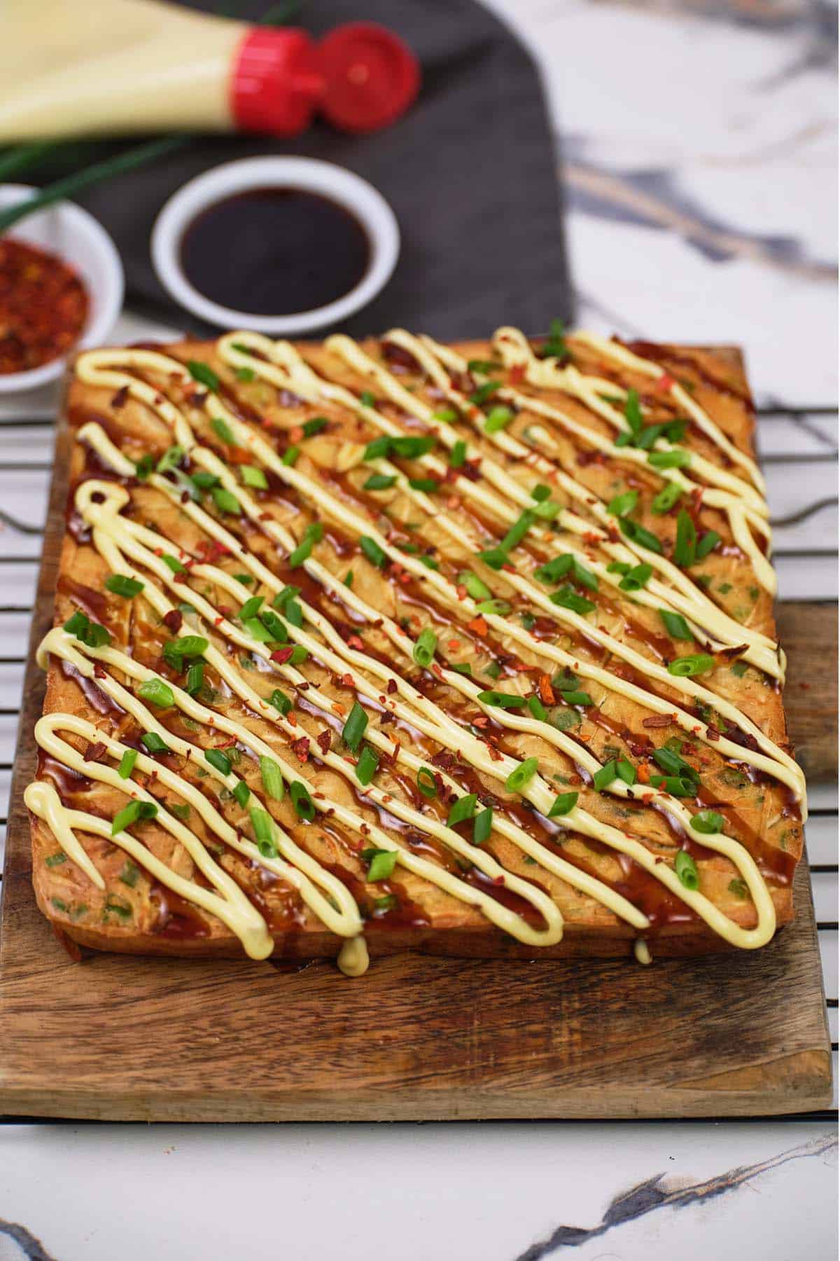 Okonomiyaki bake on a cutting board fresh from the oven