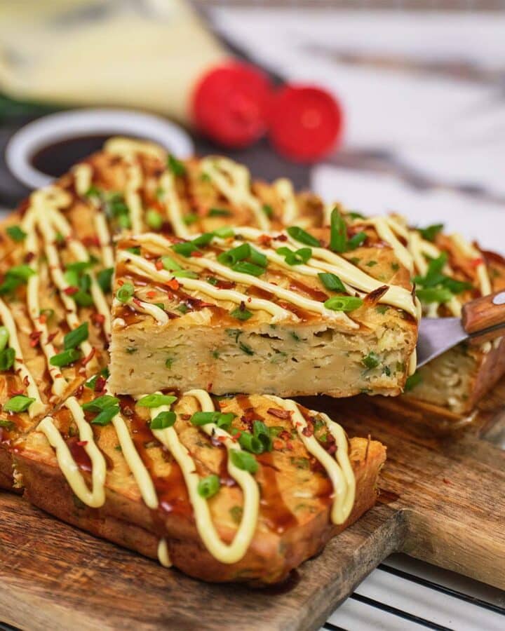 serving of Okonomiyaki bake being lifted using a spatula