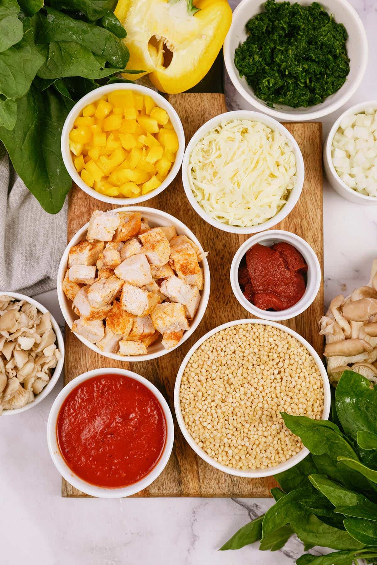 ingredients to make Pizza Casserole with Couscous laid out on a table