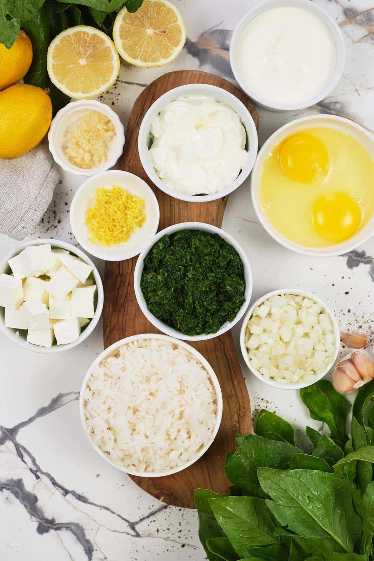 ingredients to make Spinach, Feta & Rice Casserole laid out on a table