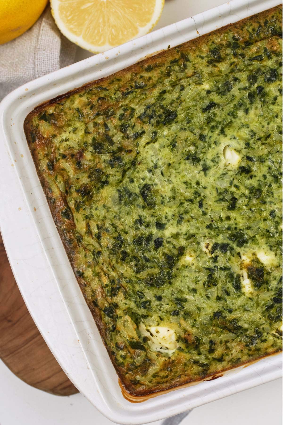 closeup of a baking dish of Spinach, Feta & Rice Casserole fresh from the oven