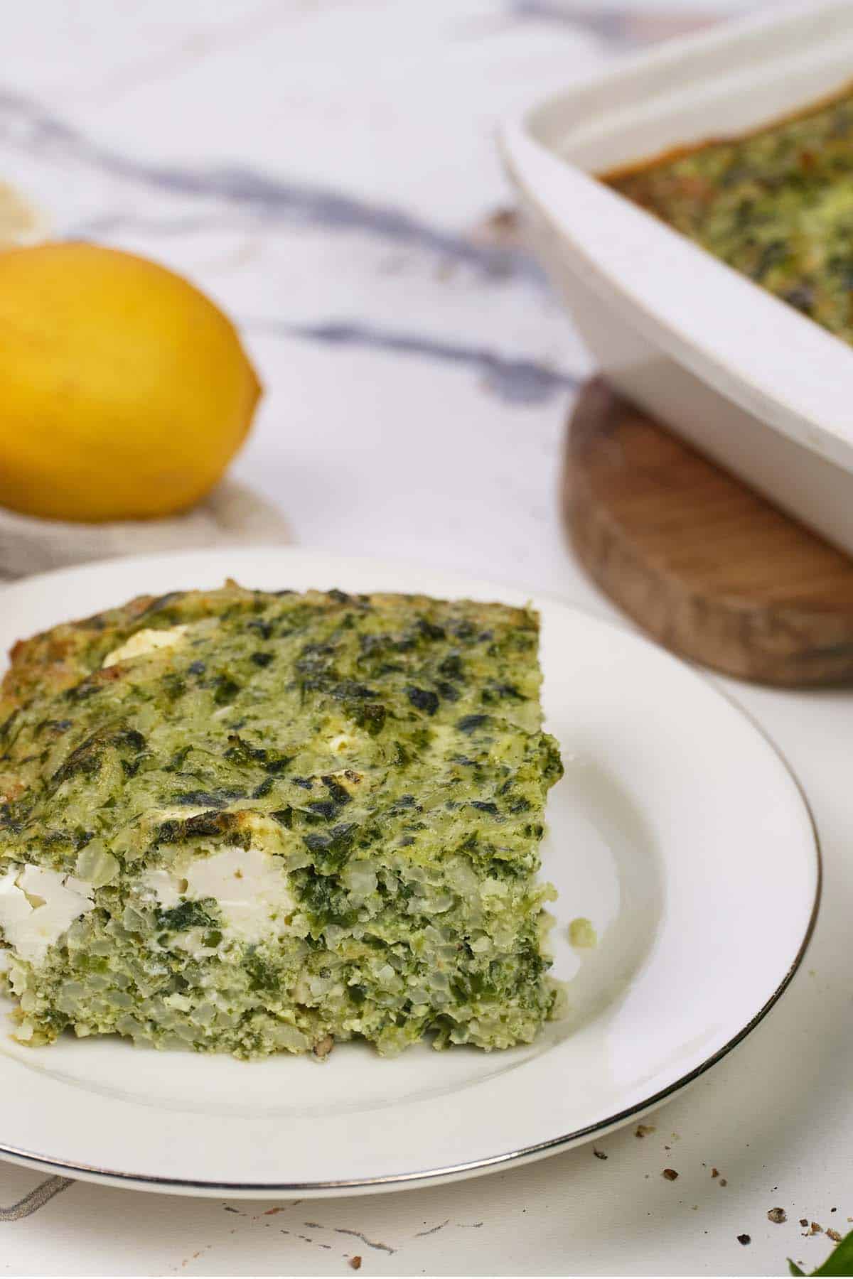 serving of Spinach, Feta & Rice Casserole on a plate ready to enjoy