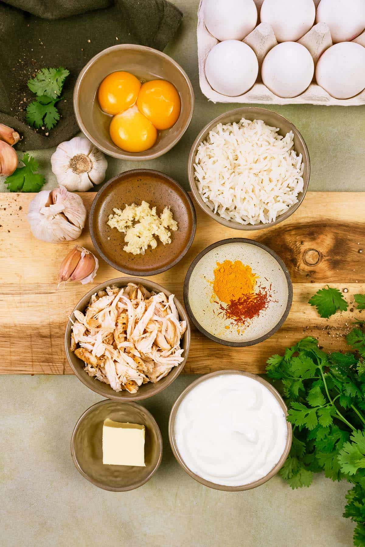 ingredients to make Tah-Cheen (persian baked chicken and rice) laid out on a table
