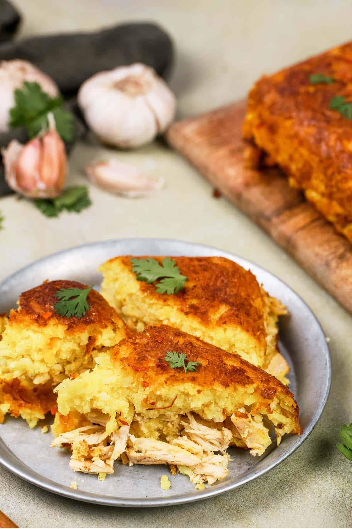 plate with a serving of Tah-Cheen (persian baked chicken and rice) ready to enjoy