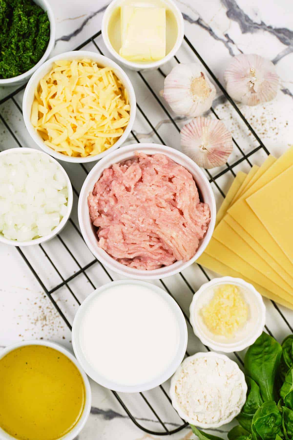 ingredients to make baked skillet lasagna laid out on a table