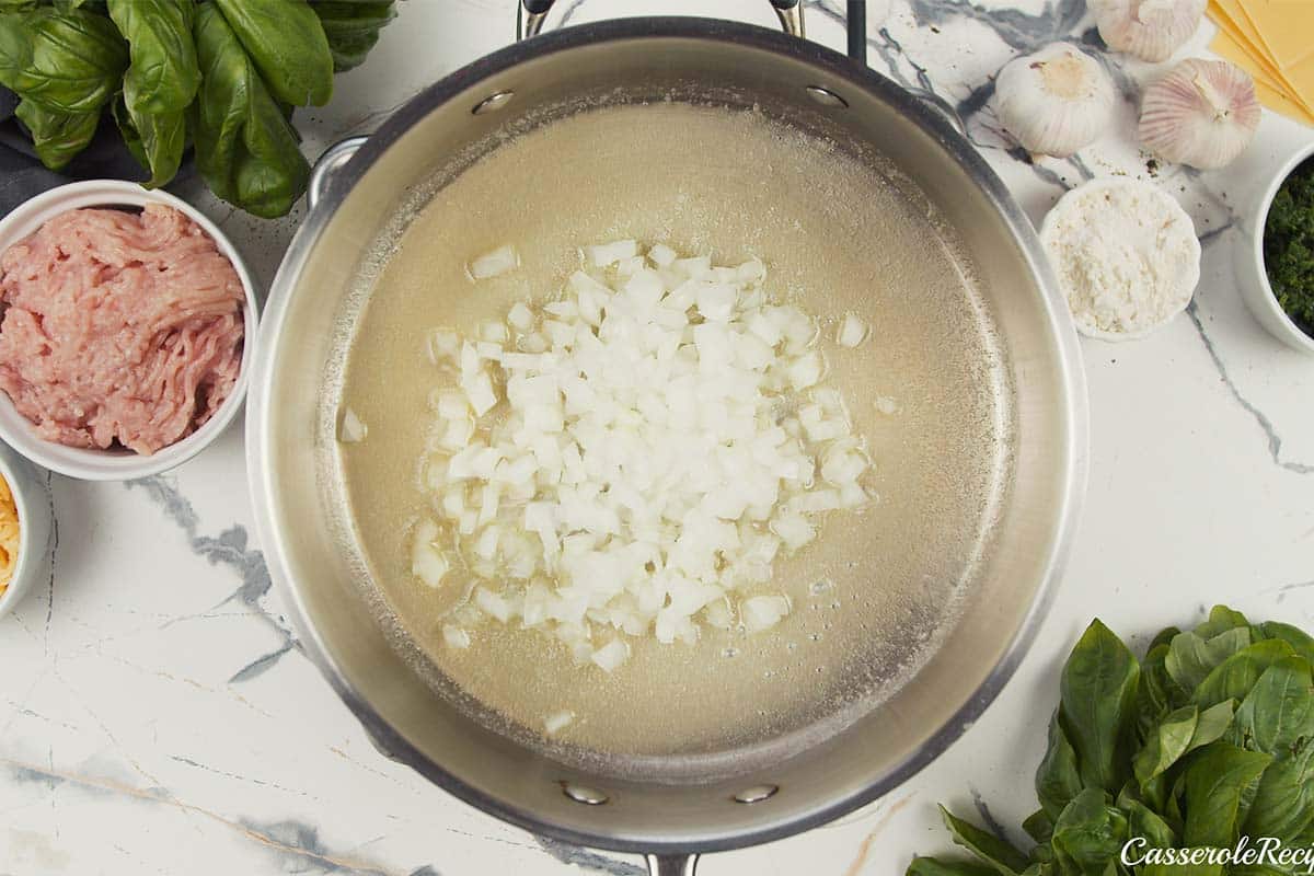 onions being sauteed to make baked skillet lasagna