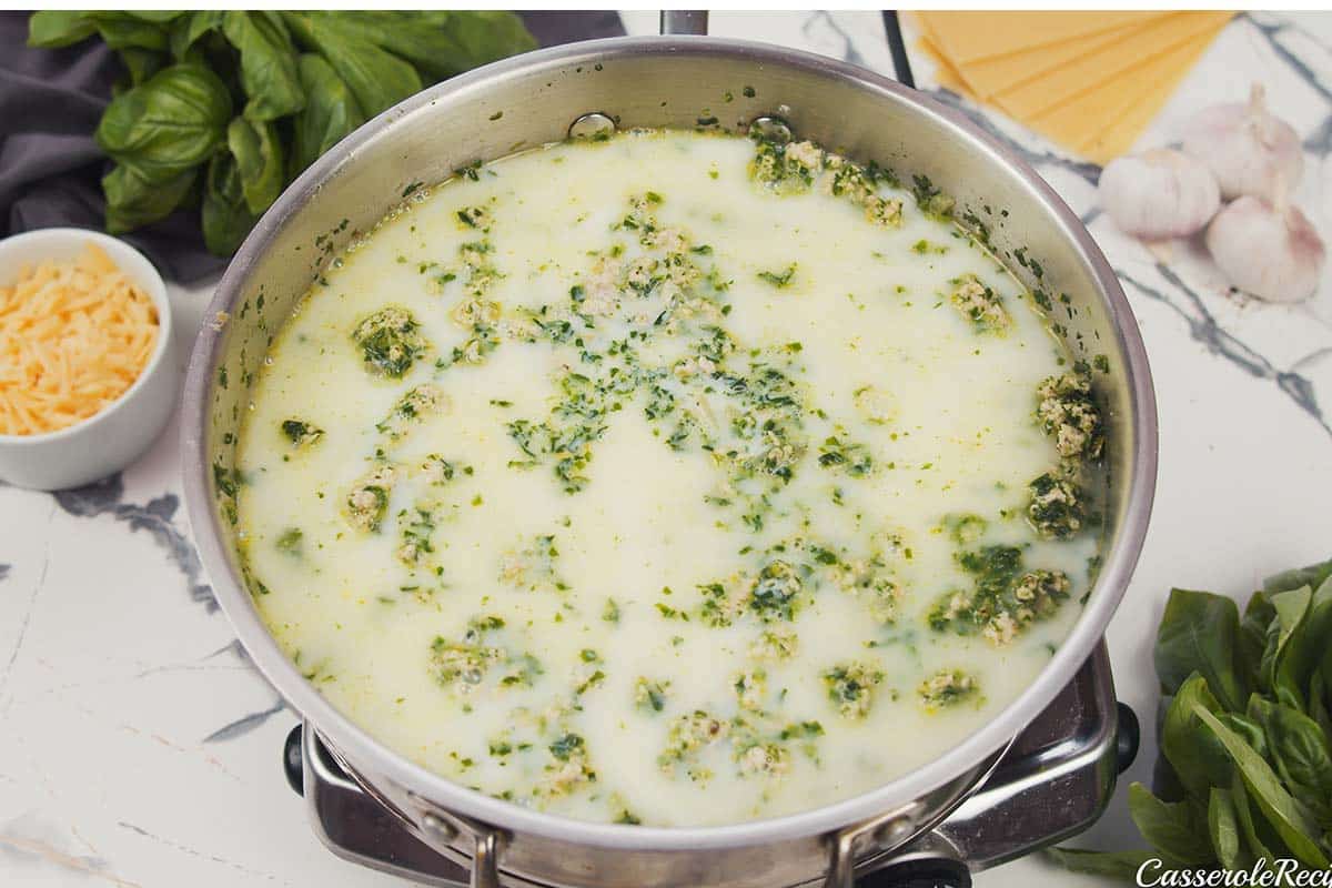 ingredients being sauteed together to make baked skillet lasagna