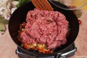 meat and other ingredients being cooked to make cheat lasagne bake