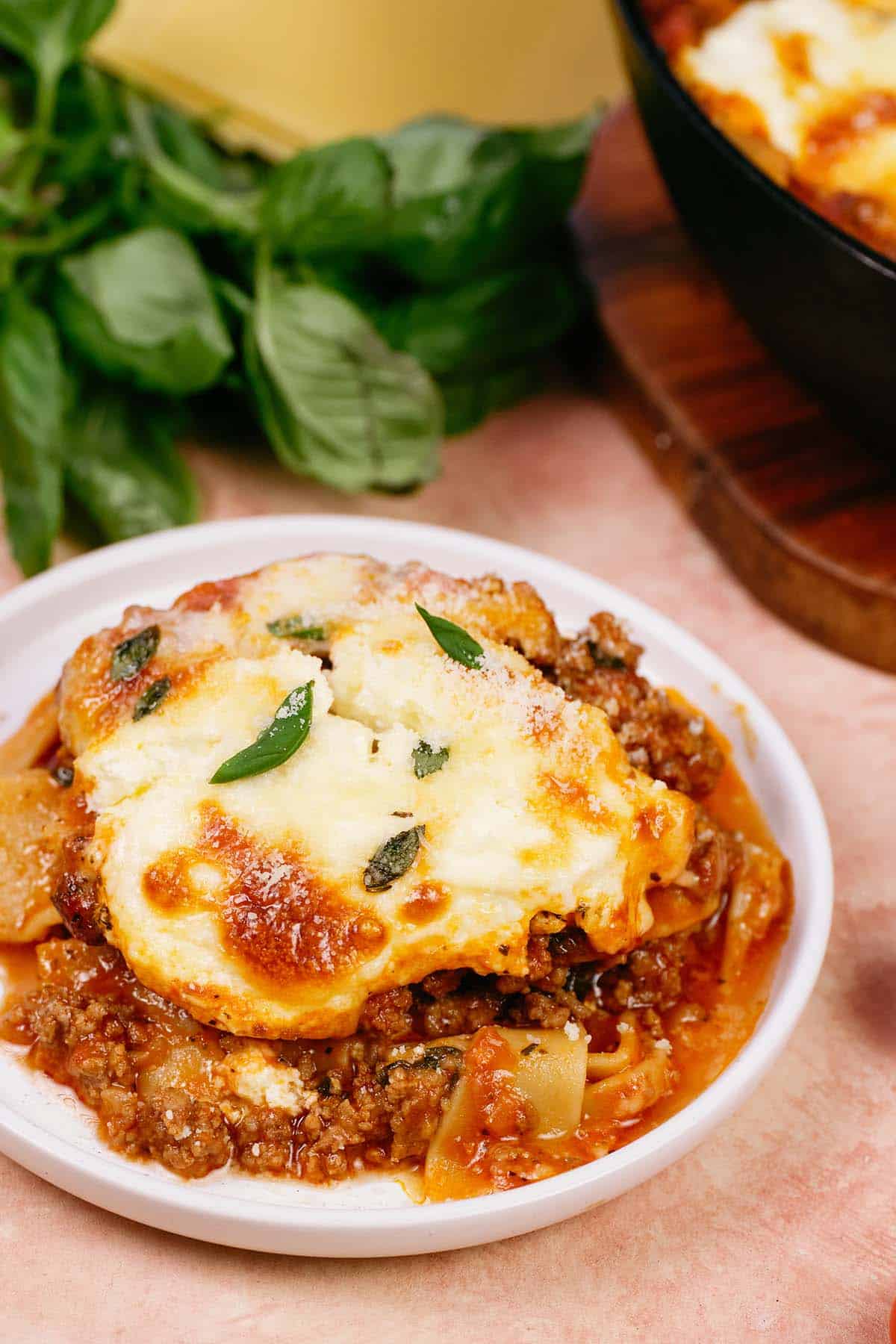 bowl with a serving of cheat lasagne bake on a table ready to enjoy