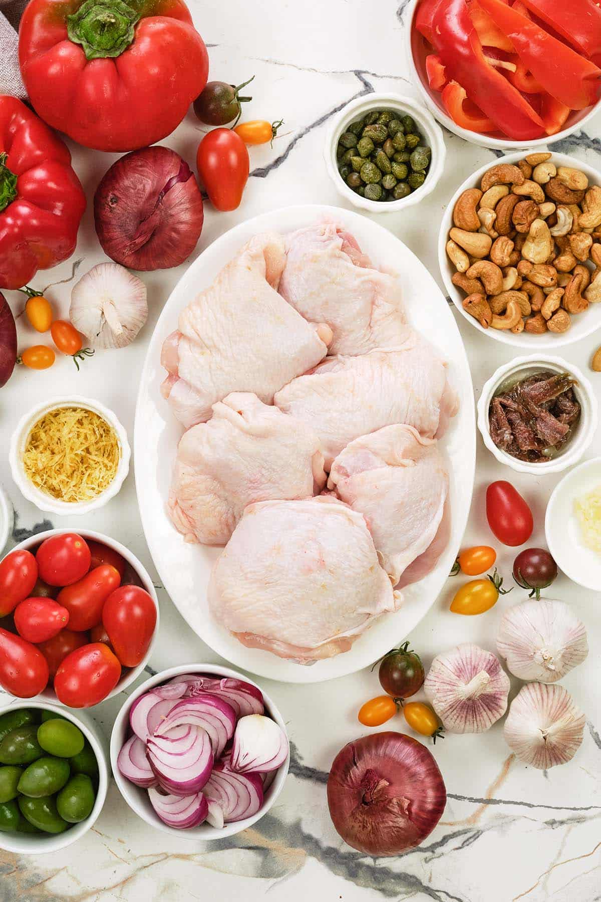 ingredients to make chicken bake with anchovy cashew laid out on a table