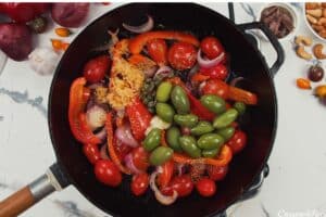 vegetables being sauteed to make chicken bake with anchovy cashew